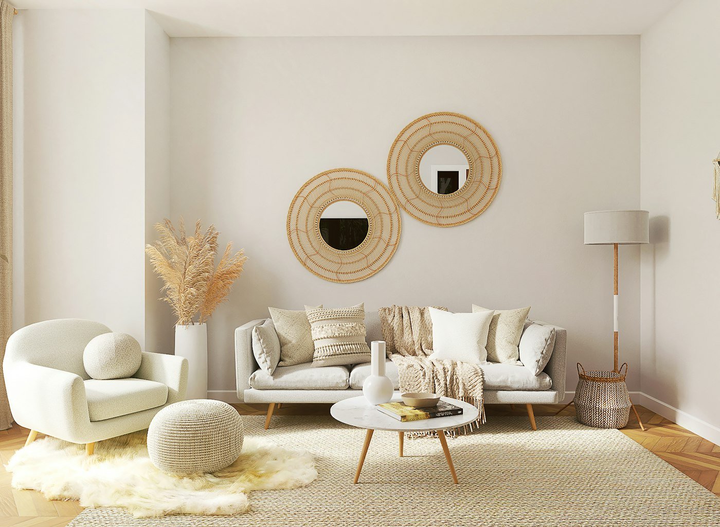 A pale living room with a beige sofa, two round rattan mirrors, and a low wooden table